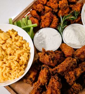 chicken wings party board with macaroni